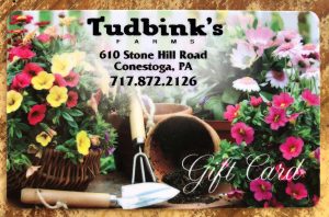 gift card with gardening equipment and flowers