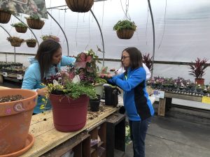 2 people creating planters in Tudbinks' planter workshop