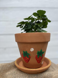 small planter with two painted strawberries