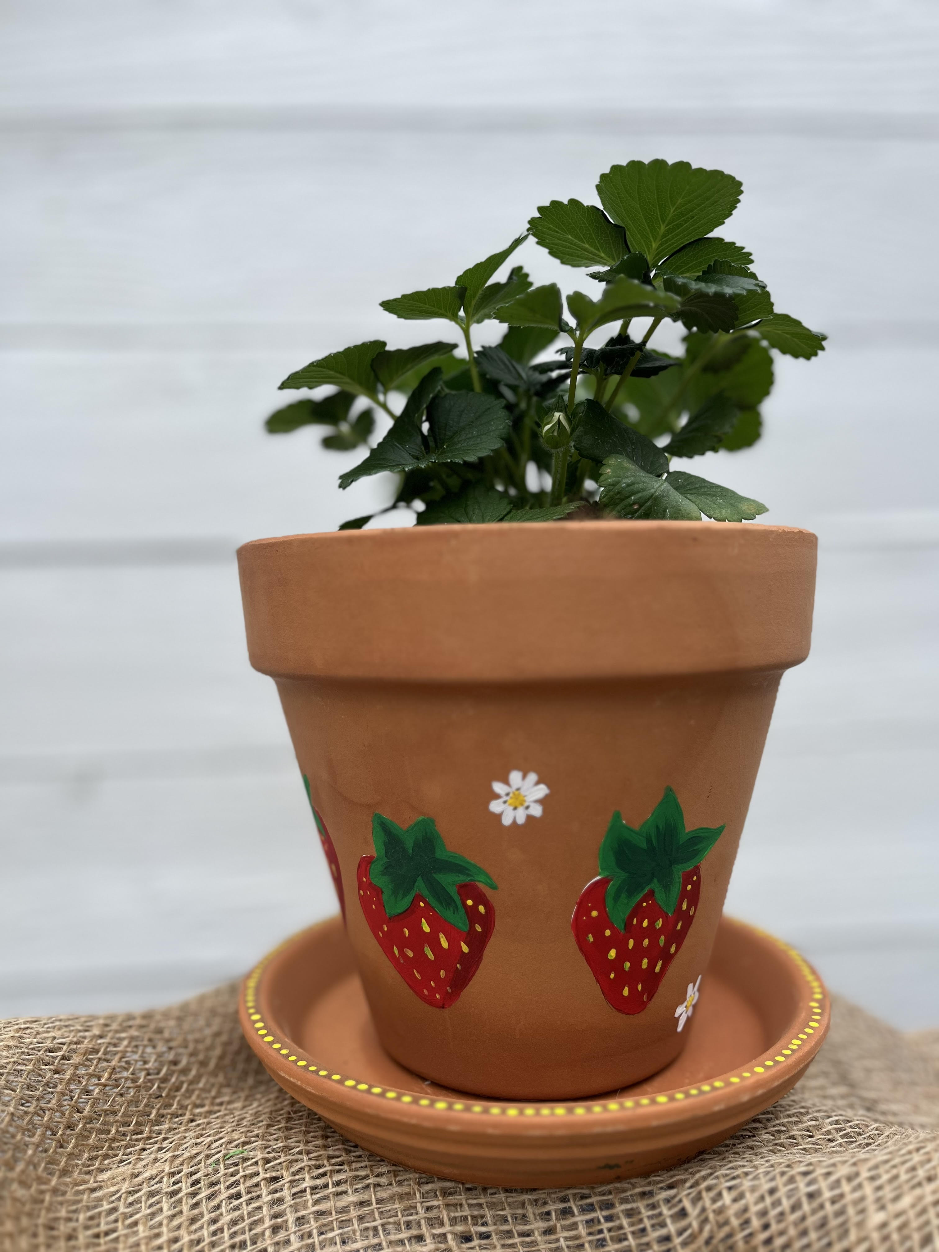 small planter with two painted strawberries