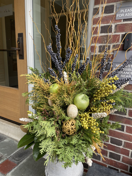 winter planter with green and yellow foliage